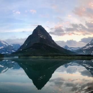 Snowy mountains reflected in lake