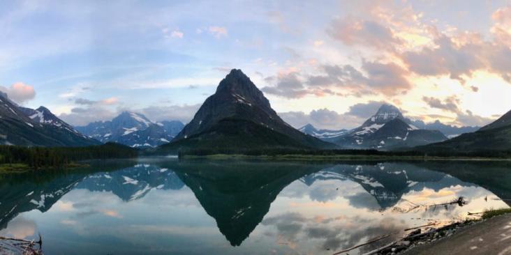 Snowy mountains reflected in lake