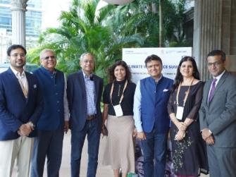 Members of various India-based organizations standing next to one another at the Climate Workforce Summit