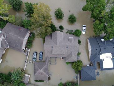 A flooded residential neighborhood, viewed from overhead.